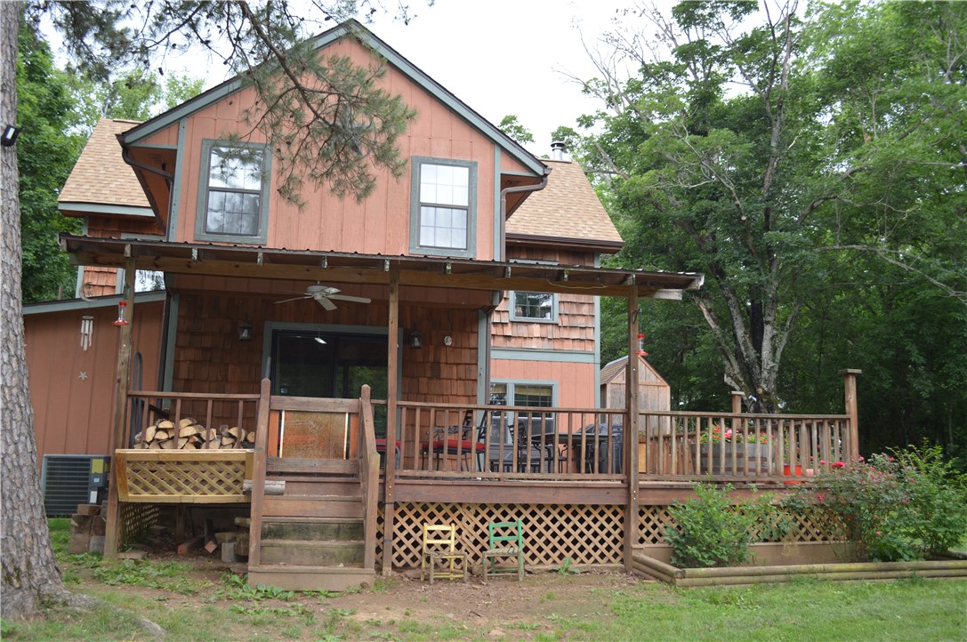 This property has so many features to offer.  The expansive 6.7 acres offers an active outdoor firing range and equipped shooting equipment room.  This area could also be easily used as a future building site for a large shop building or second residential site.  The home is located just a short walk away from the range with cedar and spruce siding and all the rustic charm of a wooded retreat without ever having to drive on any rural / dirt roads.  An asphalt driveway runs the entire way to the home with gated access.  At the back of the property is a hidden pond with a live spring.  This property also offers an RV hookup site and exterior outlets and running water.