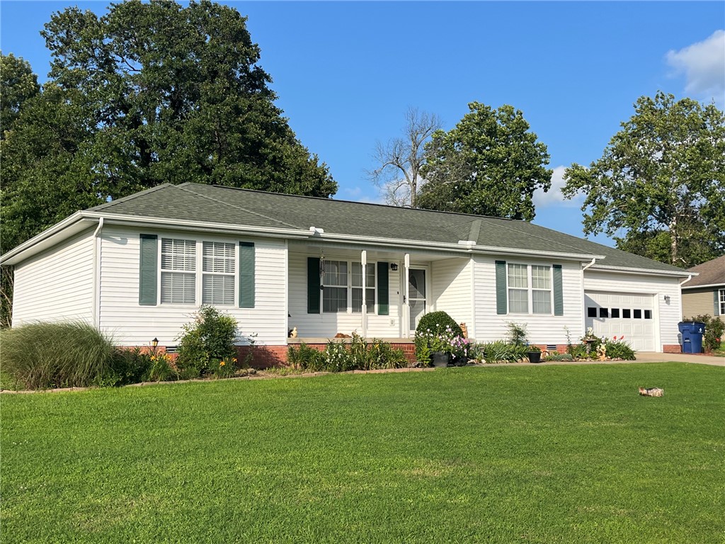 Immaculate 3 bed 2 bath home just on the outskirts of town with 1.15 beautiful, landscaped acres in a quiet neighborhood.  This home offers beauty, comfort, and a backyard paradise. Come take a look.