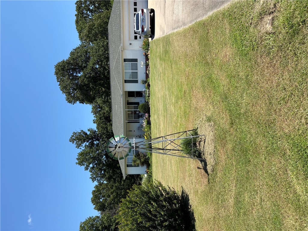 Immaculate 3 bed 2 bath home just on the outskirts of town with 1.15 beautiful, landscaped acres in a quiet neighborhood.  This home offers beauty, comfort, and a backyard paradise. Come take a look.