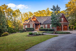 Rustic Elegance! You will love this private edge of town setting! 1.65 acres located in one of Harrison's most popular areas. This custom built 3 or 4 bedroom, 3 1/2 bath, 10 year old home is in excellent condition. Approximately 3733 sq ft with 18 ft ceilings in the living area, gas log fireplace with beautiful rock work, open floor plan and hardwood floors. An awesome kitchen with granite counter tops, breakfast bar, stainless steel appliances, and pantry. Nice master bedroom with sitting area, walk-in closet, double sinks, large separate shower and jetted tub. Upstairs has a bonus room perfect for a 4th bedroom, rec room or office. The basement has 10 ft ceilings, den/rec room and wet bar/kitchenette and storage room.