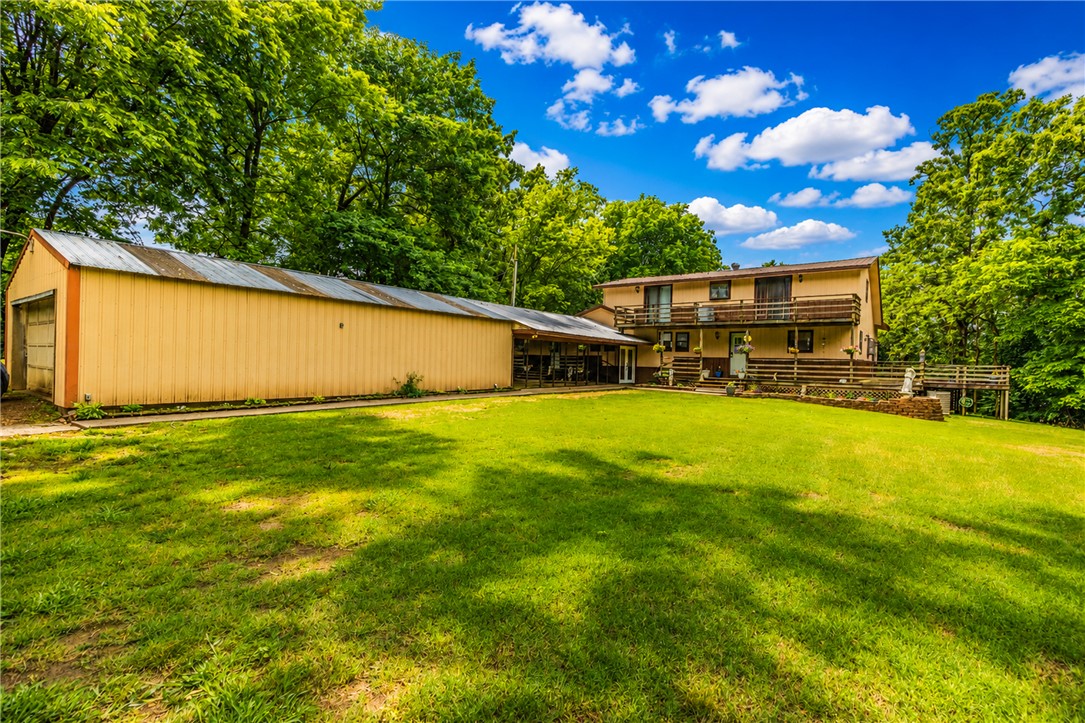 Tucked away on 1.5 beautiful acres in the peaceful countryside of Siloam Springs, this rustic retreat offers the perfect blend of charm, space, and privacy. Featuring 3 bedrooms, 3 bathrooms, and a unique two-level layout, this home is full of warm character and inviting living spaces designed for comfortable country living.

Step outside and enjoy the serene setting complete with a picturesque koi pond, mature landscaping, and a rustic outbuilding perfect for a workshop, hobby space, or additional storage. Whether you’re sipping coffee on the porch, entertaining guests, or simply enjoying the quiet surroundings, this property delivers the kind of peaceful lifestyle people keep pretending they can get from a “luxury apartment community.”

If you’ve been searching for a property with acreage, personality, and room to breathe, this one is a rare find. Property Sold AS IS. Add your own charm and creativity and make it HOME