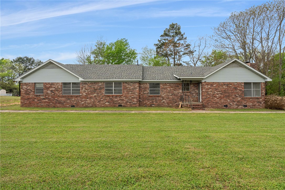 Up to 7.54 +/- acres! This 4-bedroom, 2-bath brick home offers the perfect blend of convenience and privacy in town! Situated on approximately 1.16 acres, it provides plenty of space while still being just minutes from Lavaca schools and local shopping, and only 20 minutes to Fort Smith. Inside, you’ll find a comfortable layout with recent updates that add both style and functionality. A large family room with a cozy fireplace creates a great space for gathering and relaxing. The home is ideal for families or anyone looking for a move-in ready property with room to grow. Step outside to a patio area out back, perfect for entertaining or enjoying the peaceful setting. The back portion offers added seclusion, giving you privacy and space to unwind. Covered parking provides convenience and protection from the elements. Whether you’re looking for space, updates, or a convenient location, this property checks all the boxes. An additional approximate 6.38 +/- acres can also be purchased for $65,000. See last photo.
