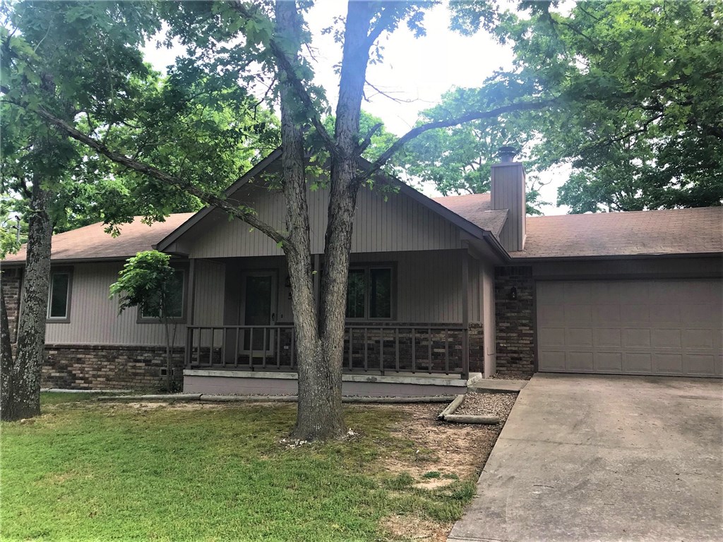 3 BR/2 BA. Cathedral Ceiling in living room w/ wood fireplace. Open Living/Kitchen/Dining Area. Over sized 2 Car attached garage w/ additional parking on side. Level lot. Covered Front Porch & exposed rear deck. Garden area + flowering bushes. Storage shed. Bentonville Schools. Convenient location. Full appliance package conveys, includes washer/dryer. Fresh Ext. Paint. Newer flooring.NO SMOKING. Pets are negotiable w/ Homeowner approval & additional pet dep. Tenant pays additional Water dep of $100.00.