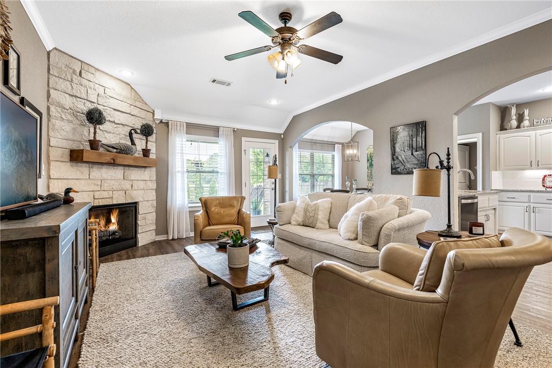 Perfection is the word. Completely reimagined, remodeled and impeccably maintained, this stunning home offers the perfect blend of timeless style, thoughtful upgrades, and peaceful outdoor living. 
Interior improvements include luxury EVP flooring, fresh designer paint including cabinetry, granite countertops, updated sinks and plumbing fixtures, garden tub, new hardware, tile backsplash, remodeled fireplace with limestone surround and mantel, updated lighting, appliances, and a beautifully custom built-in pantry. Major system updates include a new roof, covered patio, and HVAC. 
The backyard is equally impressive with professional landscaping, fencing, extended concrete patio space, outdoor fireplace, and a serene pond and fountain feature surrounded by stone accents — all overlooking a picturesque green space setting. Every detail has been thoughtfully curated to create a home that is both warm and elevated. A rare opportunity to own a truly turnkey property with exceptional indoor and outdoor living spaces.