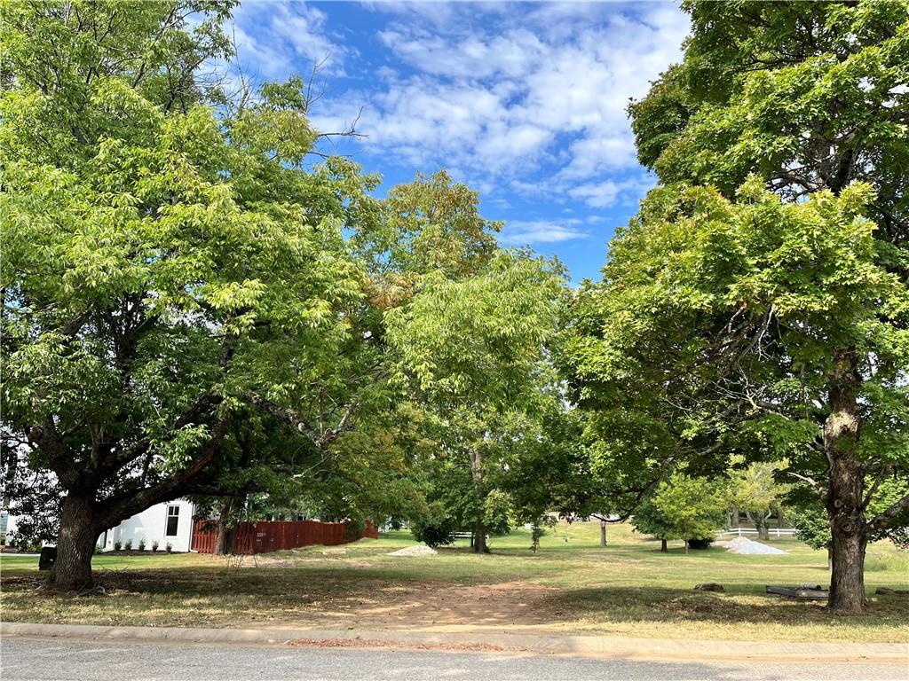 Welcome to The Port Houses at Heartfield Estates!  Surrounded by beautiful new homes and mature trees, build your own custom dream home within walking distance to Wilson Park and just minutes from the University of Arkansas.
