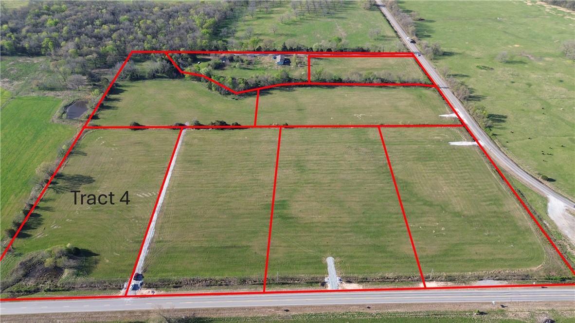 Tract 4 is 5.6 m/l acres and is located at the corner on HWY 102 in western Benton County. Located off of paved road with electric and rural water at the street, this tract provides an excellent opportunity to live in the country but have convienent access to Gravette, Decatur, Siloam Springs and the rest of NWA.