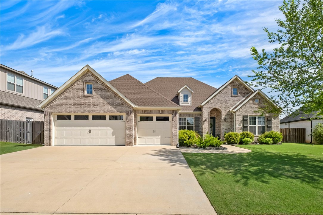 Discover effortless luxury in this beautifully designed one-level home featuring 4 bedrooms, 3 baths, and a thoughtfully designed split floorplan. The open-concept living, kitchen, and dining spaces create the perfect setting for everyday living and entertaining. The gourmet kitchen offers stainless steel appliances, a farmhouse sink, oversized island, and abundant prep and gathering space. Escape to the private primary suite tucked away for comfort and relaxation, while a dedicated office provides flexibility for work or study. Step outside to the covered back porch overlooking the backyard complete with a custom putting green—designed for entertaining and enjoying outdoor living year-round. A few additional highlights are the excellent storage throughout the home w/ abundant closet space & well-designed storage options in every area, along w/ the epoxy flooring in the garage allowing for easy cleaning. Sellers will convey kitchen refrigerator, w/d, kitchen barstools, playset & turf vacuum.