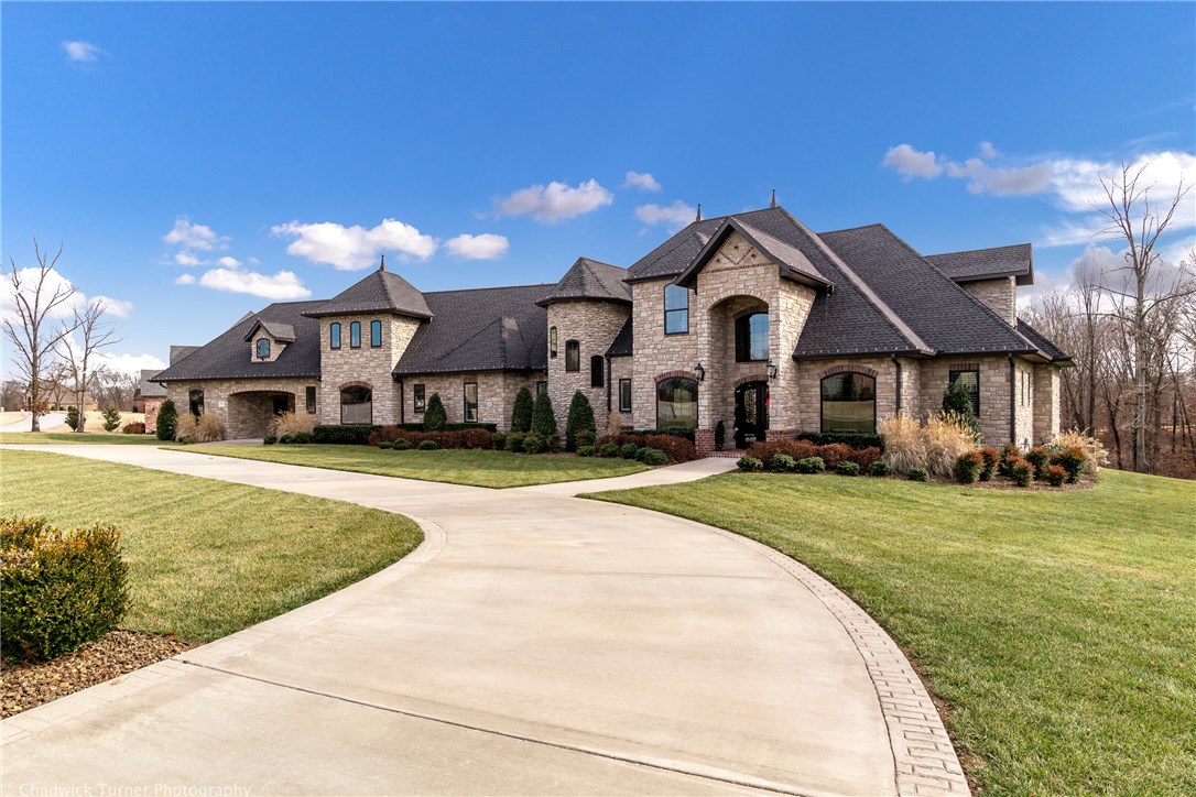 Luxurious European custom designed open concept home with high-end details will never go out of style. Inviting Great room with wall of windows & fireplace connects formal dining & kitchen. Coffered ceiling adds drama to this chef's dream kitchen, added bonus is a butler's pantry. Huge master suite, Serenity Air Tub, walk-thru shower, oversized closet; Executive office/built-in bookshelves; media/game room has 2 built-in bars, movie theater seating & 112" projector; Outdoor paradise with kitchen, fireplace, 18x39 Gunite pool & space for a full basketball court.
