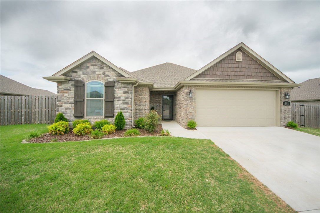 Beautiful, lightly lived in home built by Riverwood Homes in 2017. Shows like new! Very open kitchen, dining, and living room. Granite counters, and beautiful hardwood floors throughout. Great split floor plan with large closets,   Fenced yard; great covered patio in the back for entertaining. Storage building and nearly new wooden play-set for the kids.  Near schools, and just off Hwy 102 making easy access to work anywhere in NWA.