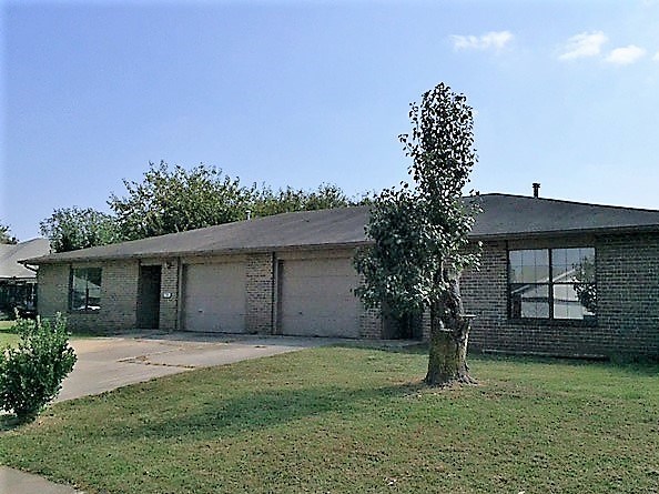 What's that sound? Opportunity is knocking! One level, all brick duplex located 2 blocks from Eastside Elementary. Settled area where tenants stay for years and years. 1289 sq. ft. each side, 2 beds, 2 baths, 1 car garage. Large corner lot. Great for investors or live on one side and rent out the other.