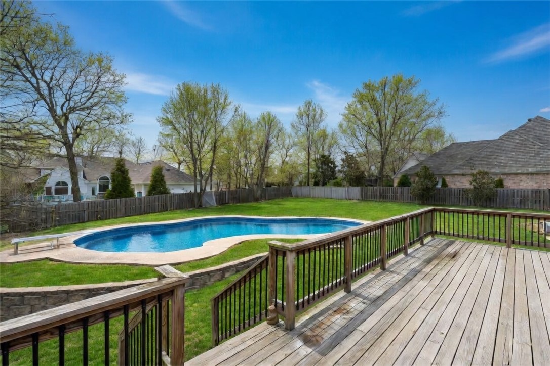 Welcome to Willow Bend! Ideally located near I-49, Tyson, Arkansas Children’s Hospital, and so much more. This stunning home offers the perfect blend of convenience and luxury. From the circle drive and inviting wraparound porch to the grand sweeping staircase, every detail makes a statement. Elegant touches throughout include custom built-ins, crown molding, and a spacious primary suite featuring a private sitting room with its own fireplace. A secondary primary suite on the main level adds flexibility and comfort. This home offers 5 bedrooms, 4.5 baths, a dedicated office, formal dining room, and an expansive media room with a kitchenette. Step outside to a deck overlooking the heated inground pool and backyard, offering a beautiful space to relax or entertain. This home truly has it all!
