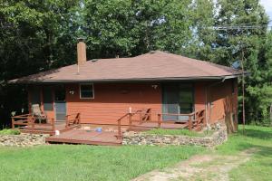 2BR, 1BA western cedar siding home located in Osage area on 40 wooded acres m/l. Full basement plumbed for 2nd BA. CH&A. Nice screened in porch, lrg garden area, 4 car-detached insulated garage (30x40 gar/workshop bldg) w/opener, concrete flooring & electric. 2 garage doors- 1 is 10 ft. Adjoining 40 acres also for sale (#132358) GPS: 36.151425,-93.389432
