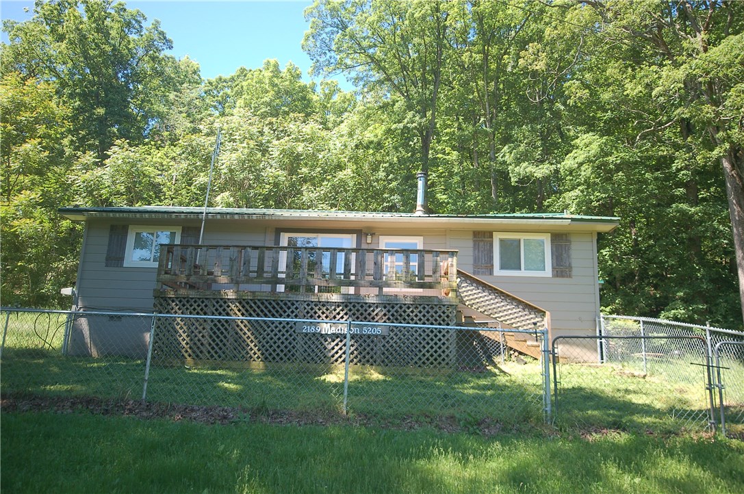 This is a wonderful country home with many updates and improvements.  15 beautiful acres  Central H/A & a woodstove.  New tile, cabinets, backsplash, farm sink, overhead light fixtures, & d sink faucet.  The washer, dryer, stove/oven, microwave, and refrigerator convey with the home.  New interior doors, front door, new shutters, new windows, interior, & exterior paint. 2 septic tanks. Spring fed pond.  Several outbuildings, storage bldgs, a chicken coop, a greenhouse & a workshop (24x24) with electric.