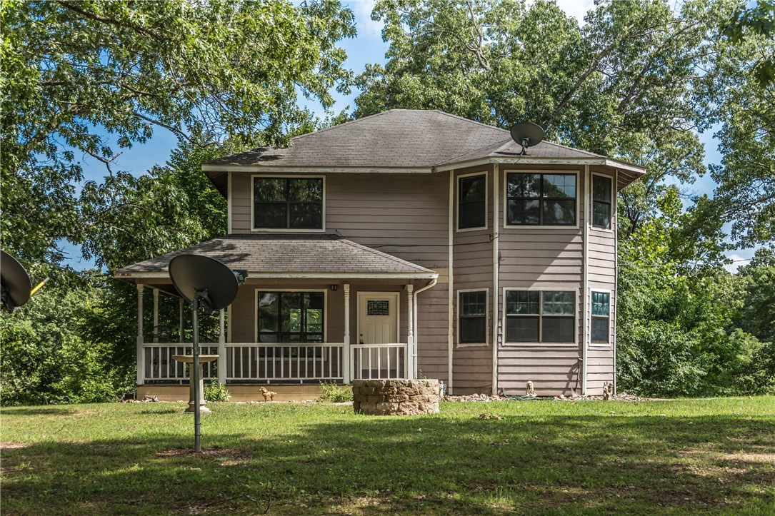 Nice 2 story house sitting on nearly 30 acres.  This is an incredible opportunity to own a large amount of land close to town with development potential or just enjoy the privacy.  There are new houses being built in the area.  The house has nice finishes throughout and the appliances in the kitchen are included!  There is SO MUCH potential with this property to use it like it is or add anything you desire to it!!!