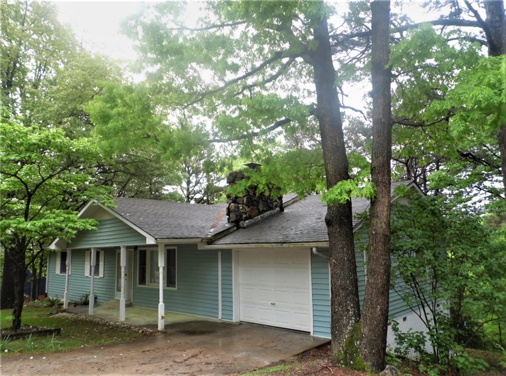 Wonderful location in The Pines Subdivision just off East Mountain Drive.  Convenient to schools, shopping and banking.  Attractive home with stone fireplace, large eat-in kitchen with pretty wood cabinetry, updated wood laminate flooring, and sliders to deck with gorgeous view over the woods from your dining area.  Good sized bedrooms, linen and coat closet, too.  Garage, and full, unfinished basement with rough bath, utility, and mechanical area, plus tons of space to finish out or use for storage.