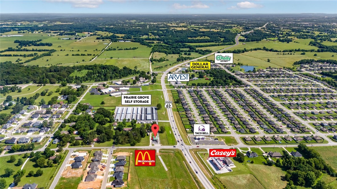 Corner lot for sale or ground lease in a rapidly developing Prairie Grove commercial corridor. This property is perfect for any business requiring high visibility along Hwy 62. Surrounded by new subdivisions, and within 15 minutes of I-49.

Property located at 4-way lighted corner.

Near recently constructed Casey's General Store & Taco Bell. McDonald's & Domino's coming soon.

Commercial zoning with all utilities on site.

Approx. 333' of frontage on Hwy 62.

Owner will ground lease.