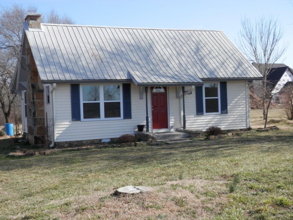 Cute little cottage, all remodeled including new windows, carpet/laminate, wiring, plumbing, some sheetrock, fixtures, cabinets, paint, subflooring in kitchen, one bedroom, and bath - all on .76 acres, nice and flat. Newer very nice homes on lane. Nice country! Nice stand alone carport.