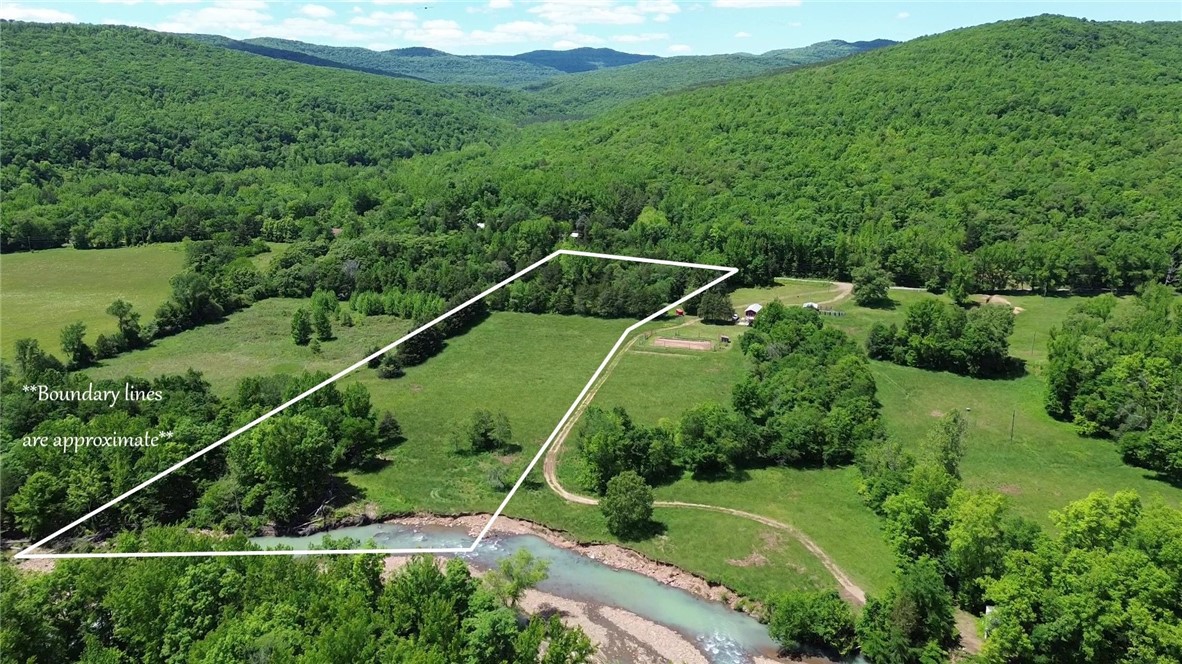 Rare opportunity to own approximately 7.8 acres along the pristine banks of Little Mulberry Creek in beautiful Little Mulberry Valley. Conveniently located just 5.9 miles north of Highway 215 in the Hazen Ford community, this scenic property features approximately 500 feet of creek frontage and 3.7 acres of partially fenced pasture. Enjoy a peaceful, level setting with the soothing sounds of flowing water and direct access from County Road 6151. The property offers an ideal blend of open pasture and creekside beauty, perfect for a recreational retreat, future homesite, or getaway. Access to the Ozark National Forest is less than a mile away in all four directions, providing endless hunting, hiking, horseback riding, and recreation. The Ozark Highlands Trail is just a few miles away.
Electricity and fiber internet are available on-site. Well and septic are required. If you're looking for creek frontage, privacy, and access to some of the best outdoor recreation the Ozarks have to offer, this property is a must-see.