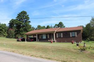 Country Living! The perfect country home for any family with 1 acre,or with more available. Just a few minutes from I-40,3 beds, 1.5 baths, living room holds 4 couches and the biggest of t.v.'s. Bathrooms are oversized for convenience. A cook's country kitchen. CH/A, separate laundry room and a carport. Neat as a pin inside and out. Nice cleared acreage with a garden, trees, and peace and quiet.