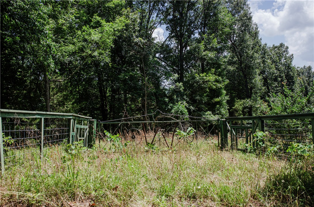 Private 3.61-acre rural property with gated entry and full perimeter fencing, located just minutes off the highway with easy access via a short county road. Gently rolling terrain, partially wooded surroundings, and a level area offer excellent potential for a future homesite, or recreational retreat. Electricity is available on site. An existing rustic structure is located on the property and is being sold as-is. Enjoy privacy, natural beauty, and the convenience of being only a short drive from Berryville and surrounding areas.