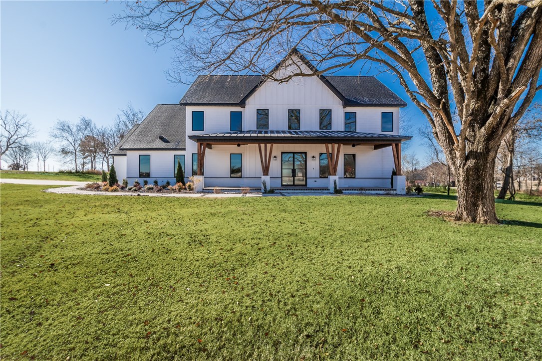 Great modern farmhouse by OAK Homes sitting on 1.43 acres in the gated community of West End. This 5 bdrm, 5 bath home features an open kitchen and living room, a luxurious master suite, a second bedroom and bath, office, wet bar and game room all on the main level. Upstairs are 3 additional bedrooms, one en-suite and two with a jack-n-jill bath. Enjoy the garage door that fully opens to the covered back patio complete with tongue and groove panel ceiling. Tons of high-end finishes throughout including Pella windows and doors, Wolf range, built-ins and many more.