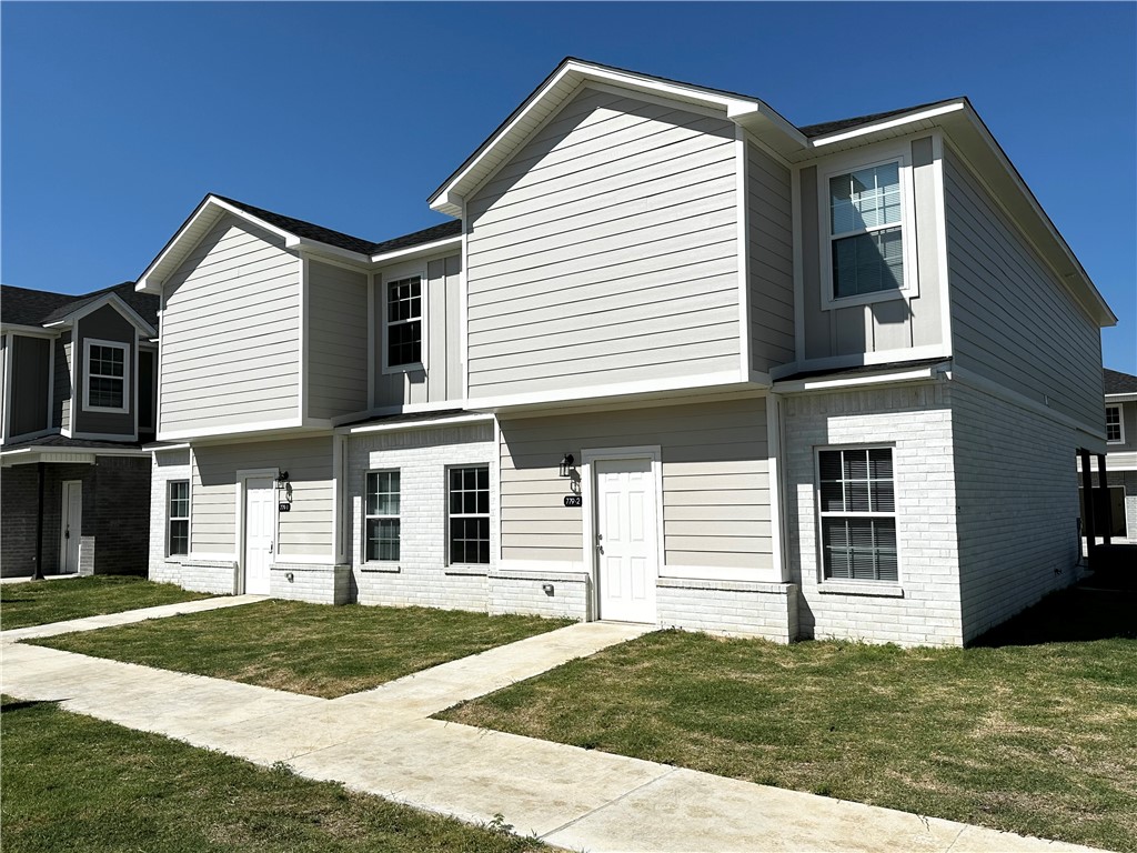 Perfect housing for University of Arkansas students in search of off-campus accommodations. The main floor offers a spacious open layout, while upstairs features 4 bedrooms, each with its own en-suite bathroom and walk-in closet, as well as a private balcony. Enjoy the convenience of a 2-car garage and two driveway spots, eliminating parking concerns.