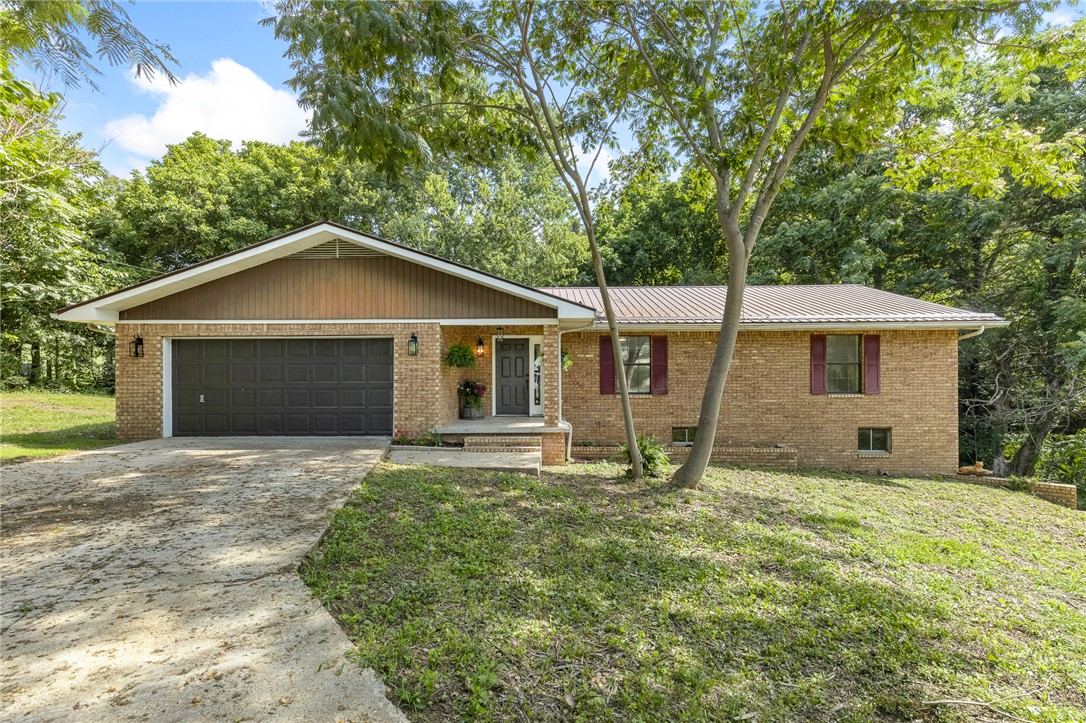 This beautifully renovated 4-bedroom, 2.5-bath home is move-in ready. The main level features 3 bedrooms and 2 full bathrooms, while the partially finished basement offers a 4th bedroom, a half bath, and poured concrete walls—providing endless possibilities for additional living space, a game room, home office, or guest retreat. The stunning kitchen has been completely updated with brand-new quartz countertops, modern appliances, and stylish finishes. Throughout the home you'll find durable Cortec luxury vinyl flooring, while the bathrooms feature beautiful tile and updated fixtures. Each bedroom offers generously sized closets, providing plenty of storage. Step outside onto the new deck that spans the entire back of the home—perfect for entertaining, grilling, or simply relaxing while enjoying the outdoors. Whether you're searching for your forever home, a vacation getaway, or an investment opportunity, this property offers the flexibility to serve as a primary residence or a short-term rental.