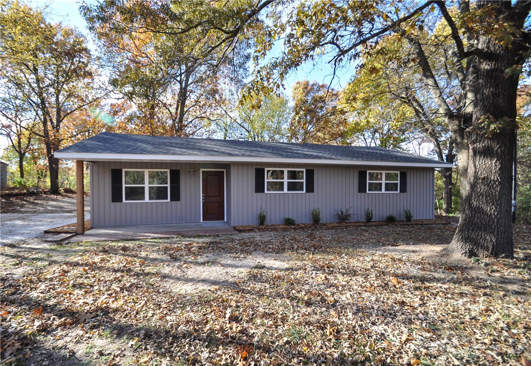 Beautifully remodeled home by Southridge Renovations located in west Fayetteville on 1.03 +/- acres. Has Craftsman feel. Beautiful wide plank lathed look hardwood vinyl flrs in LR & KIT. KIT features granite countertops, ss appliances & brushed nickel faucet. Nice sized laundry room & pantry next to KIT. New carpet in BR's. Bathrooms have beautiful tile floors, granite countertops, brushed nickel faucets & high efficiency low flush toilets. Huge backyard perfect for grilling out or entertaining friends.