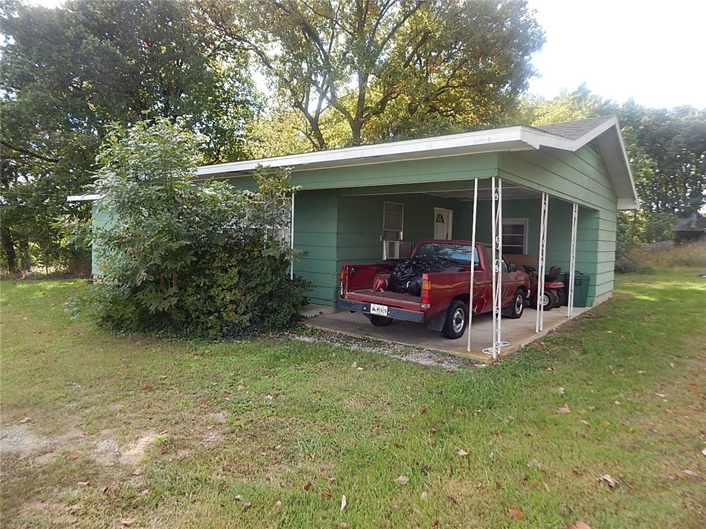 Solid 2BR, 1BA home with attached carport, needs some ceilings repaired. Close to walmart, sells as-is subject to probate court approval.