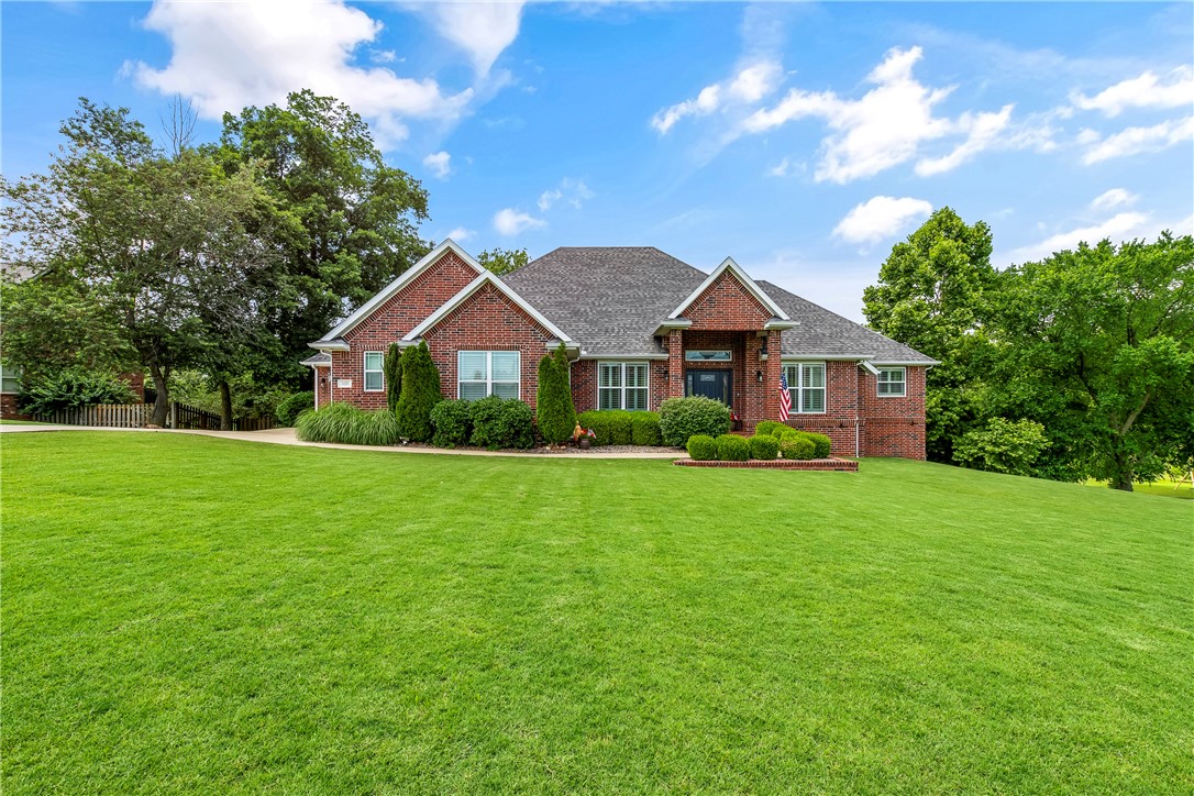 Set on 1.09 wooded acres, this meticulously maintained home offers the perfect blend of privacy, comfort, and functionality within the highly sought-after Bentonville School District. Designed with multigenerational living in mind, the spacious layout features generously sized bedrooms and a lower-level kitchenette—ideal for extended family or guests.
Enjoy seamless indoor-outdoor living with both a covered deck and patio overlooking the serene, tree-lined property. The walkout basement not only provides easy access to the outdoors and additional living space, but peace of mind during Arkansas storm and tornado season, allowing you to rest easy knowing you have a safe, secure space right at home.

Inside, plantation shutters add timeless charm and elegance. For added reassurance, the home is equipped with a whole-home generator, ensuring comfort and reliability year-round. This is a rare opportunity to own a thoughtfully designed property that combines natural beauty, modern convenience, and exceptional care.