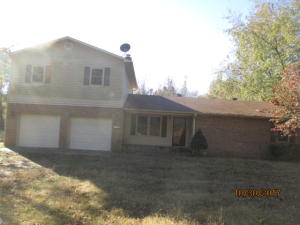 Two-level brick & vinyl home, 2-car garage, fenced back yard, shed with lean to , hardwood floors, and very large laundry room.