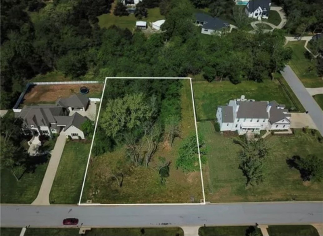 This beautiful and spacious 1.06 acre lot sits in one of the most desirable and sought after subdivisions in East Fayetteville. One of the last lots available and a rare opportunity to build your dream home in Havenwood. Lot features mostly level landscaping and mature trees to provide that private feel but close to everything NWA has to offer. Just down the road from Sassafras Springs Vineyard and less than 10 minutes to the Fayetteville business district, Lake Fayetteville, Botanical Garden, University of Arkansas, downtown and I-49 for an easy out-of-town commute. Don't miss out on your chance to own this gem of a lot!