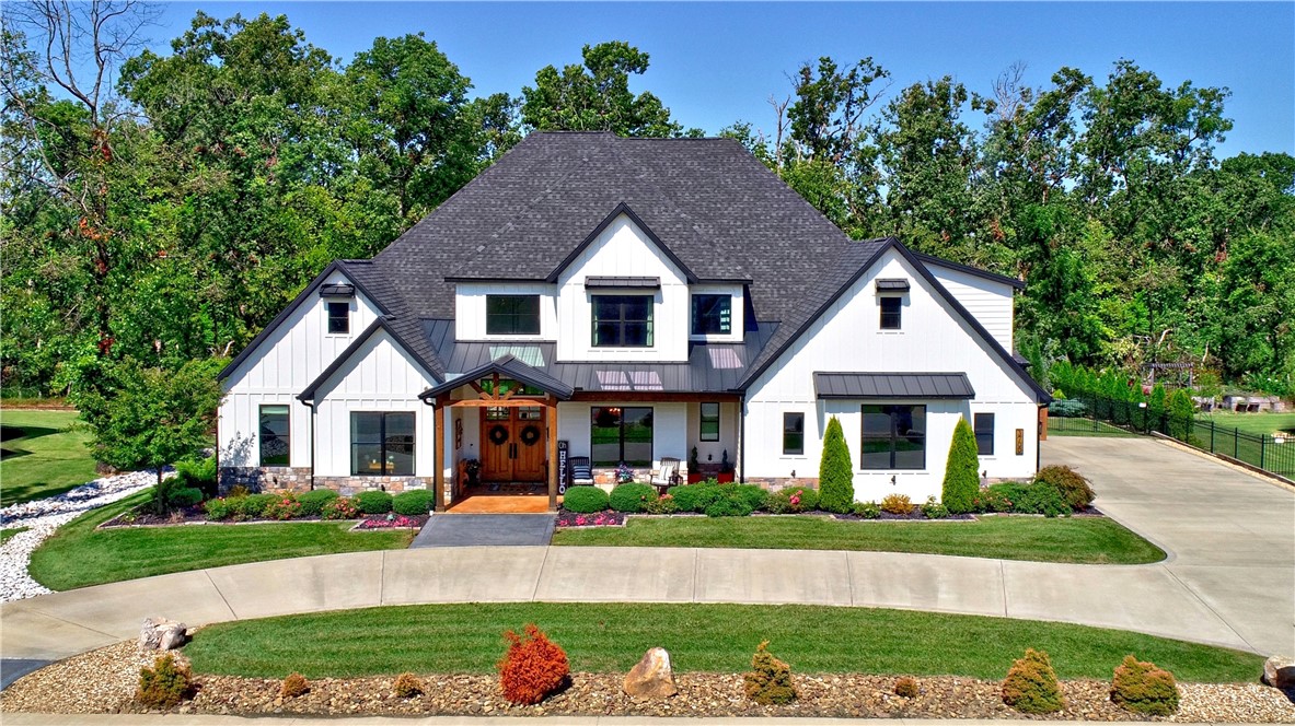 Stunning modern farmhouse 4br, 3.5 bath home in Copper Ridge Subdivision. 5 minutes to I49
and new Wmt campus. Beautiful open concept living room with cathedral ceilings, wood beams,
wood floors and fireplace. Kitchen has 12ft island, quartz counters, gas range, micro/convection
oven combo, separate ice maker, reverse osmosis water purifier. Formal dining room. In-law
suite with kitchenette plus bedroom and bath or use as a 3rd living room. Large MBR with
access to the covered patio. MBA has separate vanities, soaking tub, shower, huge walk-in
closet. Upstairs has two more bedrooms, full bath and large media/game room. Covered patio
looks onto fully landscaped yard with black beauty fescue grass, stone patio, fire pit seating,
Recteq smoker and gas grill. Lawn sprinklers. Kitchen refrigerator and TV in in-law suite convey.
Bentonville Schools.