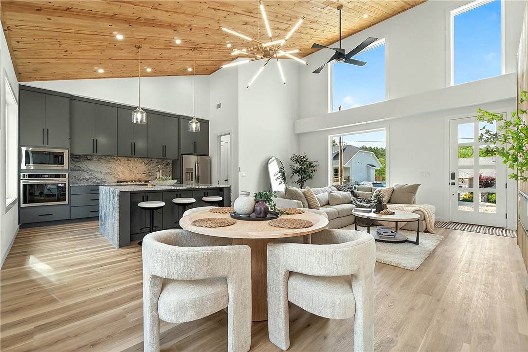 Brand-new 2026 construction offering 1,744 sq. ft. of thoughtfully designed, single-level living. This 3-bedroom, 2.5-bath home blends modern luxury with high-end upgrades rarely found in comparable new construction. Features include a custom fireplace surround, fully stained fencing with lights, sod, and a 2-car garage with epoxy flooring. The kitchen is equipped with a marble waterfall island, upgraded marble backsplash, refrigerator, and a cup rinse. The primary suite offers a walk-in closet and spa-inspired walk-in shower, plus a sitting area. Upgraded laundry room includes washer and dryer, custom shelving, and sink. Located less than .5 miles from Scottsdale Golf Course, and minutes from Lake Loch Lomond. Over $42,000 in documented upgrades beyond standard builder specifications support this home’s elevated quality, design, and value. This lot is and will be deeded as a 2-bed septic, and acknowledgement of this must be submitted in offers. 3rd room to be considered an office or other non-sleeping room.