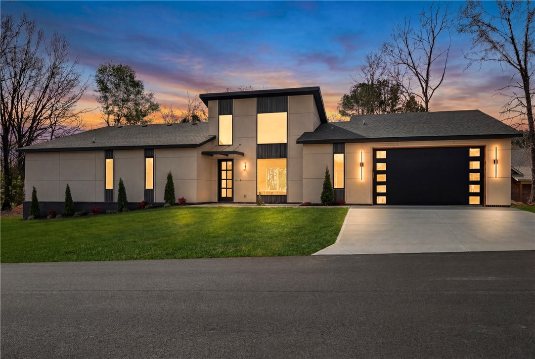 Brand-new 2026 construction offering 1,744 sq. ft. of thoughtfully designed, single-level living. This 3-bedroom, 2.5-bath home blends modern luxury with high-end upgrades rarely found in comparable new construction. Features include a custom fireplace surround, fully stained fencing with lights, sod, and a 2-car garage with epoxy flooring. The kitchen is equipped with a marble waterfall island, upgraded marble backsplash, refrigerator, and a cup rinse. The primary suite offers a walk-in closet and spa-inspired walk-in shower, plus a sitting area. Upgraded laundry room includes washer and dryer, custom shelving, and sink. Located less than .5 miles from Scottsdale Golf Course, and minutes from Lake Loch Lomond. Over $42,000 in documented upgrades beyond standard builder specifications support this home’s elevated quality, design, and value. This lot is and will be deeded as a 2-bed septic, and acknowledgement of this must be submitted in offers. 3rd room to be considered an office or other non-sleeping room.