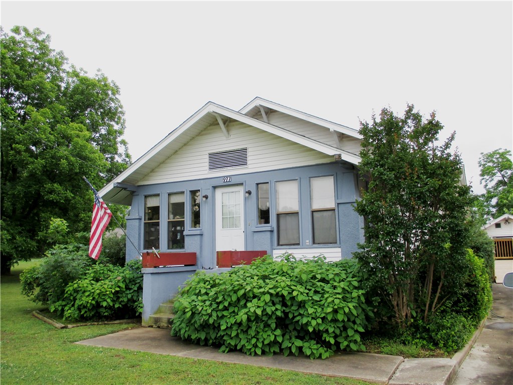 Traditional 3 bedroom, 2 bath home, very well kept and in very good shape with some updates on 1.14 acres in Gentry city limits! Public utilities, mature shade trees and barn/workshop! Convenient to shopping, etc. Handicap accessable with 1 car garage & 1 car carport, hm with full unfinished basement!