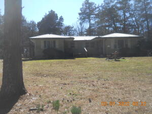 This is a Little Country home that sets back off the Hwy amongst some beautiful Pine trees  on this 2.60 acres with several storage Sheds & a stand alone Carport.This home is to be Sold ''AS IS '' No repairs will be made by the SellerThe Car & the Truck will be removed from the property.
