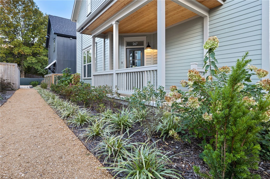 Live beautifully, comfortably, and connected in a thoughtfully designed cottage in the 11th Street Cottages community. Created around both privacy and connection, the neighborhood offers shared green spaces, native gardens, and welcoming front porches that make it easy to enjoy a true sense of community just blocks from the Razorback Greenway and Walker Park. Inside, 10’ ceilings, tall windows, and natural light create an airy, inviting feel. The main level includes a spacious living room, separate kitchen with dining area, custom cabinetry, granite countertops, tile backsplashes, and a private bedroom suite with full bath and walk-in closet. Upstairs, the large primary suite offers an office nook, dressing room/closet, double vanity bath, soaking tub, and Carrara marble. With ENERGY STAR systems for comfort, efficiency, and healthy indoor air quality, this home offers rare build quality, energy performance, and thoughtful design at a price point under $400K in Fayetteville. See https://11thstcottages.com/ for more