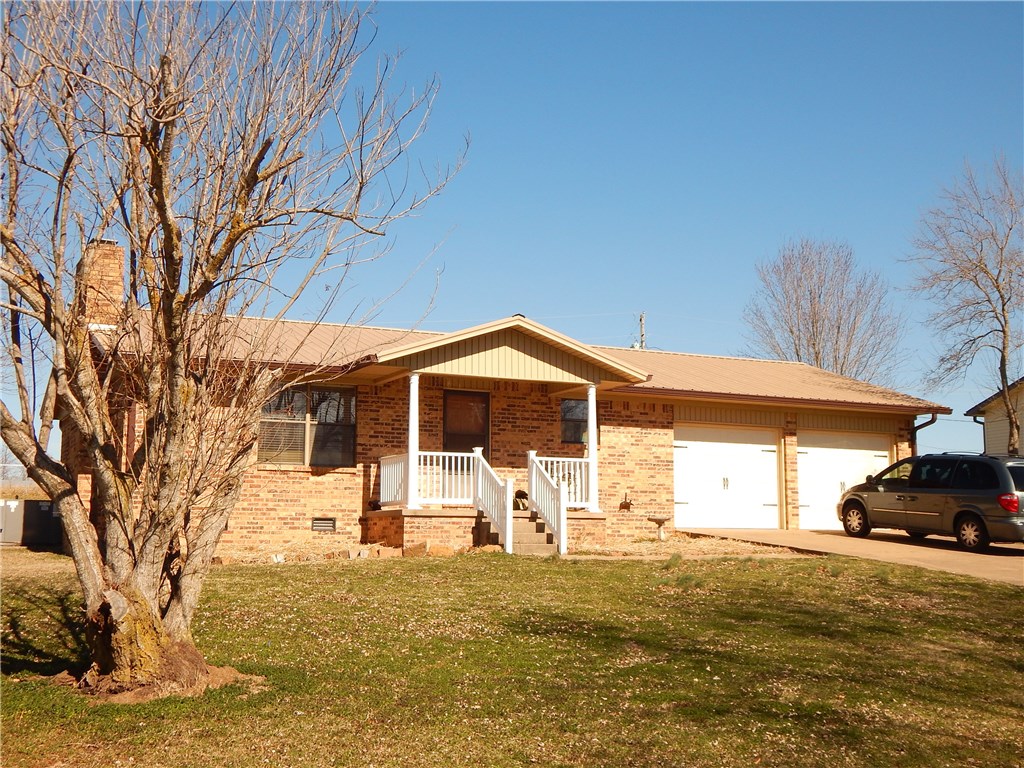 All brick home w/ metal roof -  ready to move in!  Loads of light flood the huge family room (21' x 13') featuring a beautiful natural stone fireplace complete w/ insert. Brand new wood-looked LVP (luxury vinyl plank) flooring in the living room & new carpet in the bedrooms.  The master bedroom (15x13) w/ private bath offers plenty of space for your queen sized bed. The 2nd bedroom (11.5' x 11.75') is just next door to the 2nd full bath.  Fully fenced backyard overlooks wide open field - peace & quiet!!