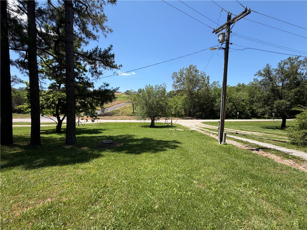 INVESTORS!!! 2-3 RV sites in a great location just inside the city limits of Huntsville. There are currently 2 sites ready with room for a third. The work has been done. The sites have city water, city sewer, internet and 50 amp electric service ready to go. Approximately 30 minutes to Eureka Springs/ Springdale/Fayetteville/ Beaver Lake areas and all that Northwest Arkansas offers. Only 5 minutes to groceries, War Eagle River, Withrow Springs State Park, ball fields, walking trails and so much more. Live on one and rent out the other 2 for income. Call for a showing today. Utility availability is the responsibility of the buyer or buyers agent.