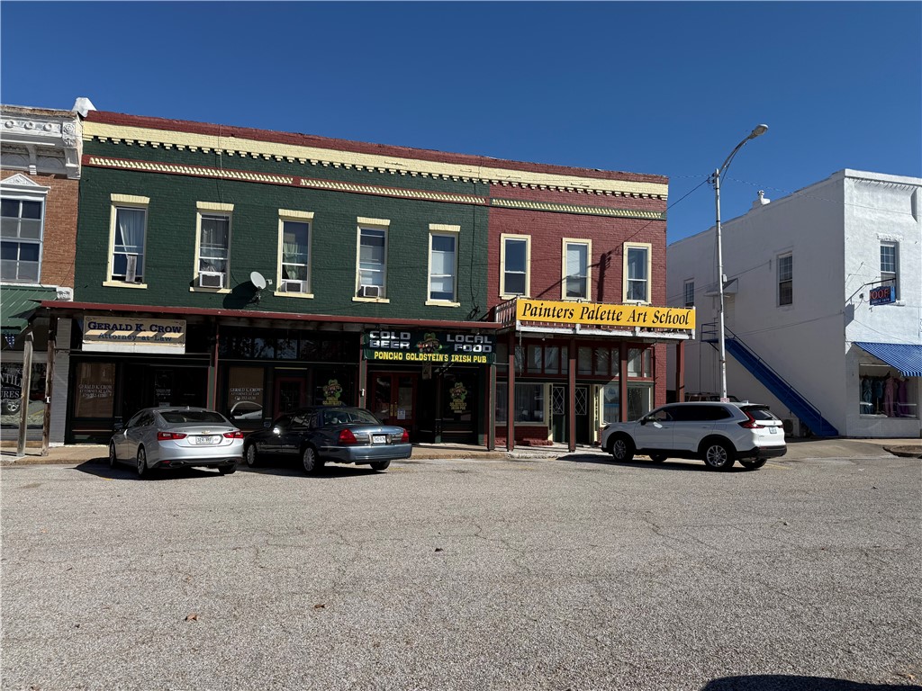 Own a piece of local history and generate income at the same time! This beautiful historic building is located right on the square and offers strong investment potential with both commercial and residential opportunities. Excellent visibility and foot traffic in the heart of the square. The main level is currently leased to an art retail store and studio, providing steady rental income. Spacious upstairs apartment — approximately 1,200 sq. ft., ideal for an owner’s residence, short-term rental, or long-term tenant. Live upstairs and rent the retail space, or lease both levels for maximum return. Part of a rare opportunity — this is one of two buildings for sale on this section of the square. Purchase one or both for expanded investment potential. Whether you’re looking for a turnkey income property, a live/work setup, or a historic downtown investment with long-term upside, this property delivers it all. Contact us today for financial details, lease information, and a private showing.