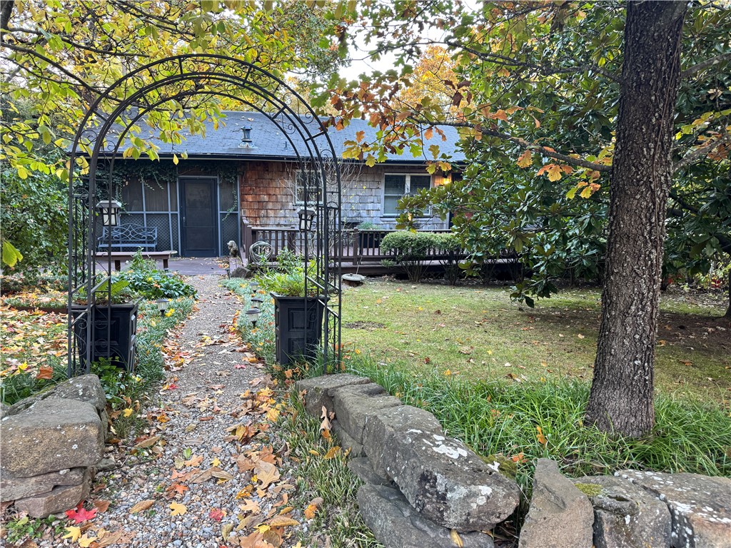 Rare opportunity in one of Fayetteville’s most sought-after locations near the University of Arkansas. Tucked away on a quiet cul-de-sac, this mid-century contemporary offers incredible potential with flexible living spaces, a separate downstairs entrance, a large screened porch, a koi pond, a spacious yard, a garden shed, and a workshop. Walkable to Leverett Elementary and the University of Arkansas campus, with privacy and mature surroundings rarely found this close to town. The seller has obtained quotes for foundation and roof repairs, HVAC upgrades, and tree trimming, and the property is priced accordingly. Being sold AS-IS. No seller repairs.

Excellent opportunity for investors, renovators, creatives, or buyers looking to personalize a home with character in an unbeatable location. This home has incredible potential in a convenient location.
