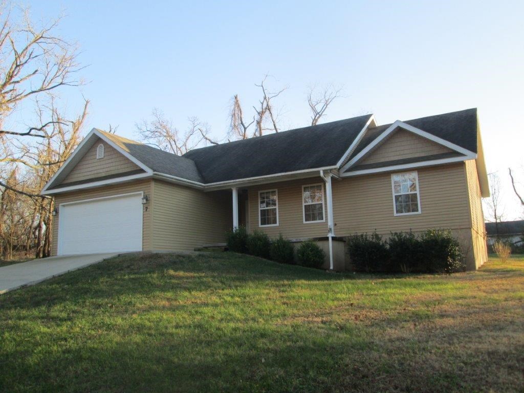 Enjoy your level, open back yard from the covered patio! This divine home comes with new paint, carpet, lighting, and dishwasher. Granite counters in the kitchen, walk-in closets, and spa tub in master bath. Plus, all the amenities Bella Vista has to offer! This is a Fannie Mae HomePath property. Sewer hook up will be required within 90 days after closing.