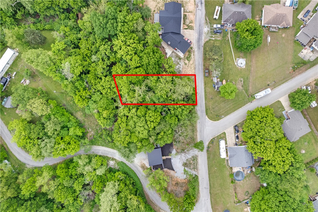 Nestled near beautiful Beaver Lake, this 0.27-acre lot presents a fantastic opportunity to create your ideal retreat, primary residence, or investment property in a sought-after lake area setting. Enjoy the charm of the Ozarks with nearby access to boating, fishing, hiking, swimming, and countless outdoor adventures. With a peaceful natural backdrop and endless potential, this property is ready for your vision—whether that’s a weekend cabin escape or a custom-built home. Experience the balance of privacy, recreation, and convenience with nearby amenities just a short drive away. Don’t miss this chance to own a piece of land near Beaver Lake.