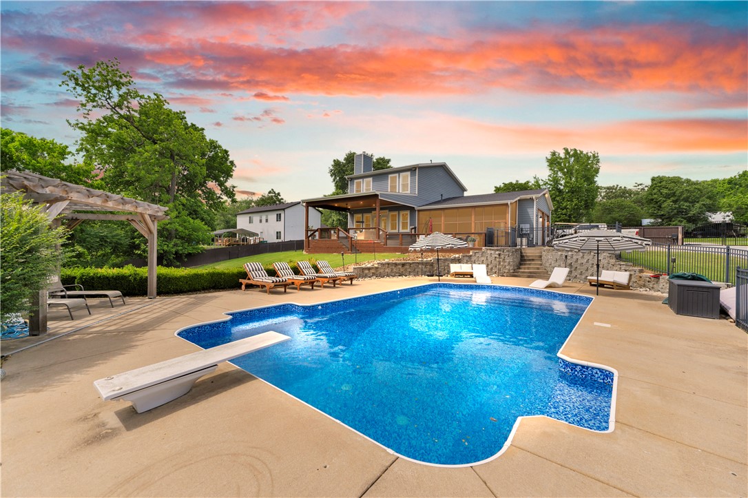 Showings Start Thursday 6/4. PERFECT blend of Nature, Comfort & Connection. Situated on 7.7 gated acres with a spring-fed pond, pool, guest house, shop, and room to roam, this is a beautifully updated retreat. RARE combination of privacy, versatility, & convenience. Minutes from Highway 612, you'll feel worlds away while remaining close to everything NWA has to offer. Whether you're dreaming of a hobby farm, multigenerational living, guest accommodations, income potential, or simply your own private staycation, this property delivers. Spend your days fishing in the pond, exploring the acreage, or hosting unforgettable pool parties. Expansive back deck and screened porch provide the perfect setting for entertaining, relaxing, & taking in breathtaking year-round sunsets. With ample space for equipment, recreational vehicles, hobbies, & outdoor adventures, the possibilities are endless. More than a home, this is a lifestyle where family can gather, guests can stay, hobbies can thrive, and every day feels a vacation!