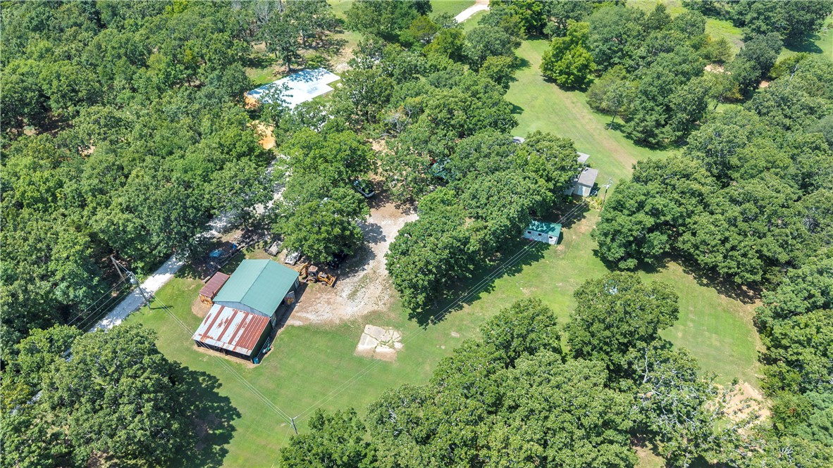 Nestled among beautiful mature trees, this well-maintained country property offers the perfect blend of privacy, comfort, and functionality. This all-electric home features an **outdoor wood furnace that can also heat the home**, providing an efficient alternative during colder months.

Relax in the hot tub and enjoy the peaceful setting. The **30' x 30' shop** with lean-tos on both sides offers excellent space for equipment, hobbies, or storage. The property is serviced by **rural water**, with a **private well** also available.

Recent updates include a **1-year-old roof**, **1-year-old water heater**, **1,000-gallon septic system installed one year ago**, and a **2-year-old HVAC system**. A move-in-ready country retreat with the updates and space you've been looking for!