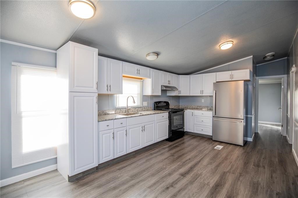 Newly remodeled home in Gravette. 3 bedroom 2 bath home with country setting. Split floor plan. Wood style flooring throughout. Kitchen features granite counters and includes refrigerator. Property sits on about 1/4 of an acre. Tenant will be responsible for lawncare. No pets