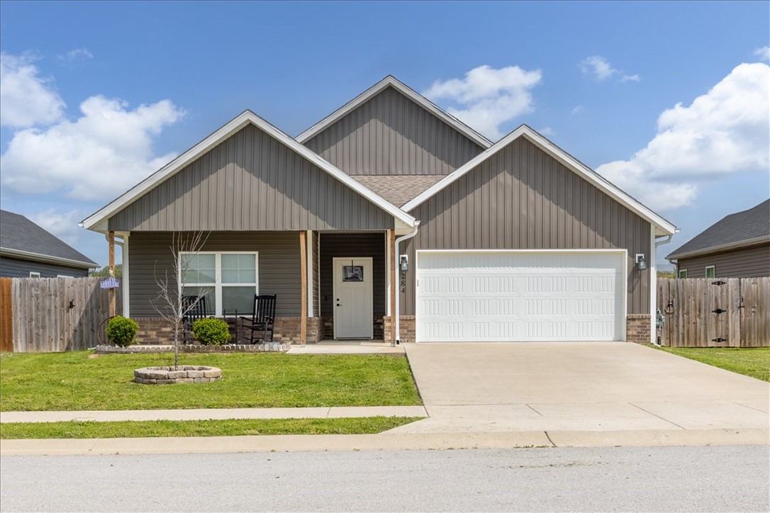 Attention all Buyers, with acceptable offer seller will give you A $5,000.00 credit that can be used for closing costs, pre paids, lender allowable's or a price reduction! This incredible home in the heart of Gentry is close to schools, dining & everything NWA has to offer. Ranch-style with an inviting feel, featuring a welcoming covered front porch that’s the perfect place to relax. Inside offers an open floor plan with 9' ceilings, 3 bedrooms & 2 bathrooms, with LVP flooring throughout. The spacious open living room features a cozy propane fireplace & flows seamlessly into the kitchen with full wood cabinets, pantry, granite countertops, stainless steel farmhouse sink & a large island built for gathering. The utility room adds function with ample space & wood lockers for organization. The primary suite is spacious & flows into a well-appointed bathroom with tile surround shower, double vanity & a large walk-in closet. Enjoy summer evenings in the private backyard complete with a covered patio & 6' privacy fence.