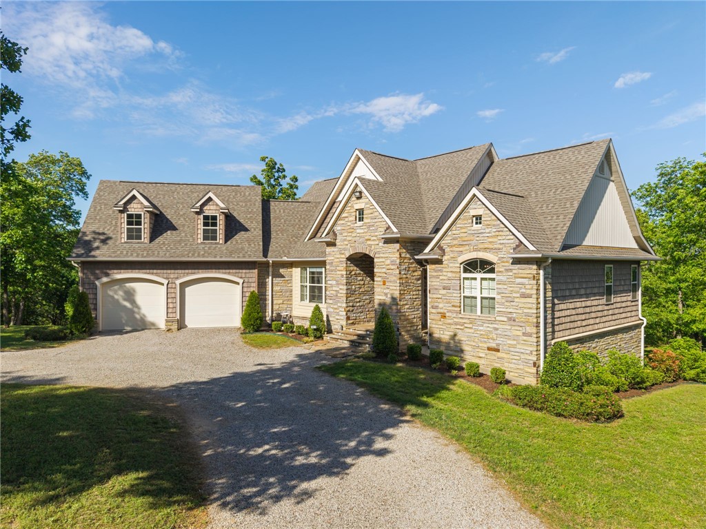 Set on 10 secluded acres in a park-like setting, this quality home offers peace and solitude just minutes from I-40 and Fort Smith amenities. Built by a detail-minded contractor for his family, the home reflects a higher standard of construction with hardwood floors, elevated ceilings, and heated tile floors, with craftsmanship and detail evident throughout. Safety and security were thoughtfully integrated, with a full-size reinforced concrete tornado room on the lower level, a dedicated vault space, and whole-house Generac backup power. A 3,200 sq ft heated shop with two RV-sized bays, full utilities, and additional storage adds lifestyle flexibility. The home’s layout, including a primary suite on the main level, 2 covered decks, and a patio, supports comfortable indoor-outdoor living in a private, peaceful setting.