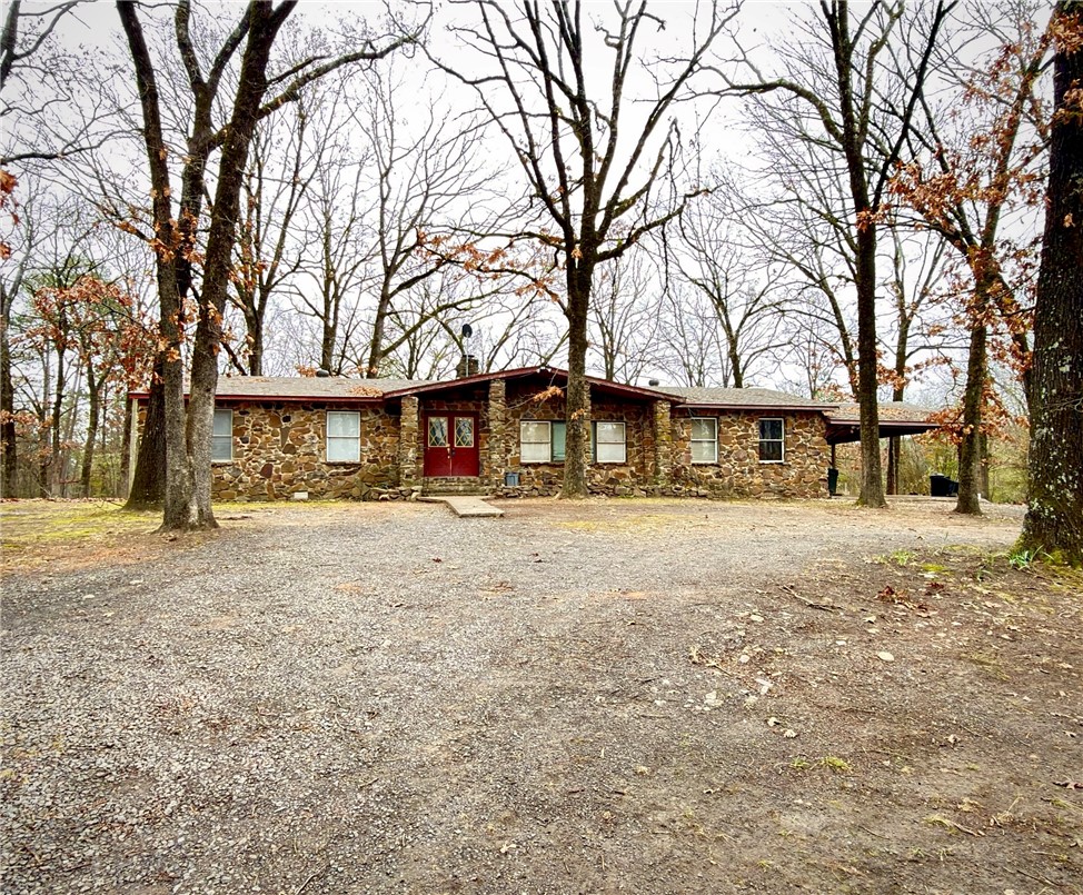 7 private acres in Ola with a large pond, two sides bordering Deltic woods, and the house sits tucked back off the road, adding to the property’s privacy and quiet atmosphere. This stone 3-bed, 2-bath home offers over 2,000 sq ft with a vaulted living room, exposed beams, and a beautiful stone fireplace. Roof and HVAC are approx. 2 years old, and a brand-new septic system was installed in November 2025. Tons of space and character ready for someone to make it their own. Deer and ducks frequent the pond, and there’s an open area perfect for a small pasture or garden. A peaceful setting for anyone wanting land, wildlife, and room to create the country lifestyle they want.